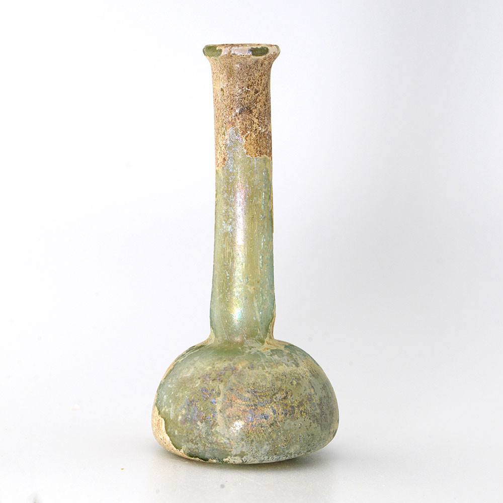 A tall Roman Glass Ungentarium, Roman Imperial, 1st century CE