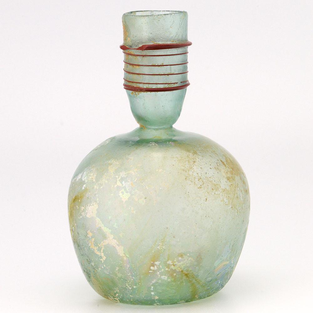 A Roman Green Glass Sprinkler Bottle, 4th Century CE