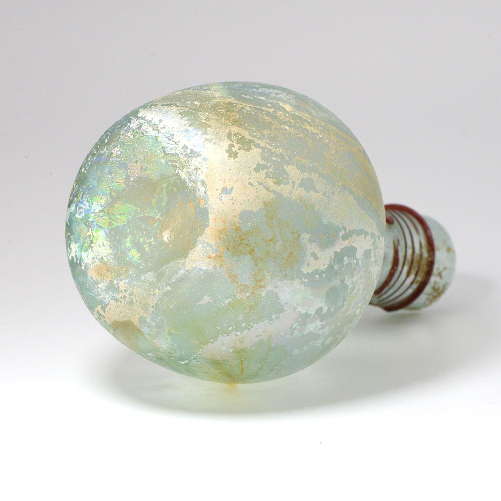 A Roman Green Glass Sprinkler Bottle, 4th Century CE