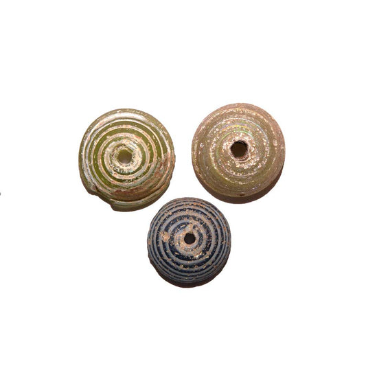 A set of three Roman Glass Spindle Whorls, Roman Imperial Period, ca. 3rd Century CE