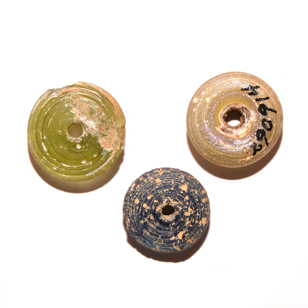 A set of three Roman Glass Spindle Whorls, Roman Imperial Period, ca. 3rd Century CE