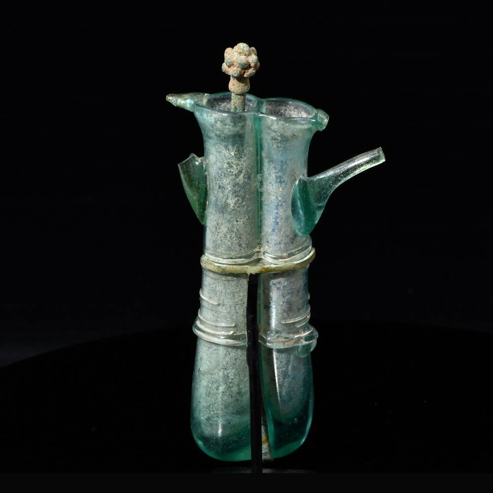 A Roman Glass Double Balsamarium with Applied Handles, ca. 4th century CE